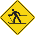 Sign with a yellow background showing a cross-country skier