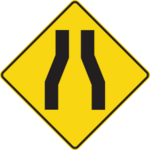 Sign with a yellow background showing two narrowing lanes.