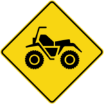 Sign with a yellow background showing a motorquad