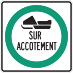 Sign with white background circled in green showing a snowmobile on the shoulder of the road