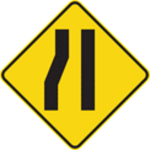 Sign with a yellow background showing a narrowing left lane.