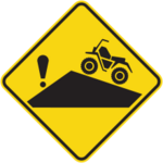 Sign with a yellow background showing a motorbikequad on a steep slope with an exclamation mark.