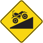 Sign with yellow background showing a motorquad on a downhill slope