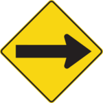 Sign with a yellow background showing an arrow pointing to the right.