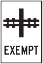 Sign with a white background showing a railway crossing a road and the word “Exempt.”