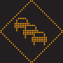 Un pictogramme lumineux en forme de losange. Trois automobiles sont en ligne, en diagonale, en son centre.