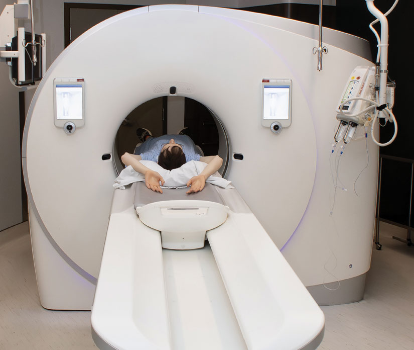 The photo shows a person having a low-dose computed tomography scan, the examination to screen for lung cancer.